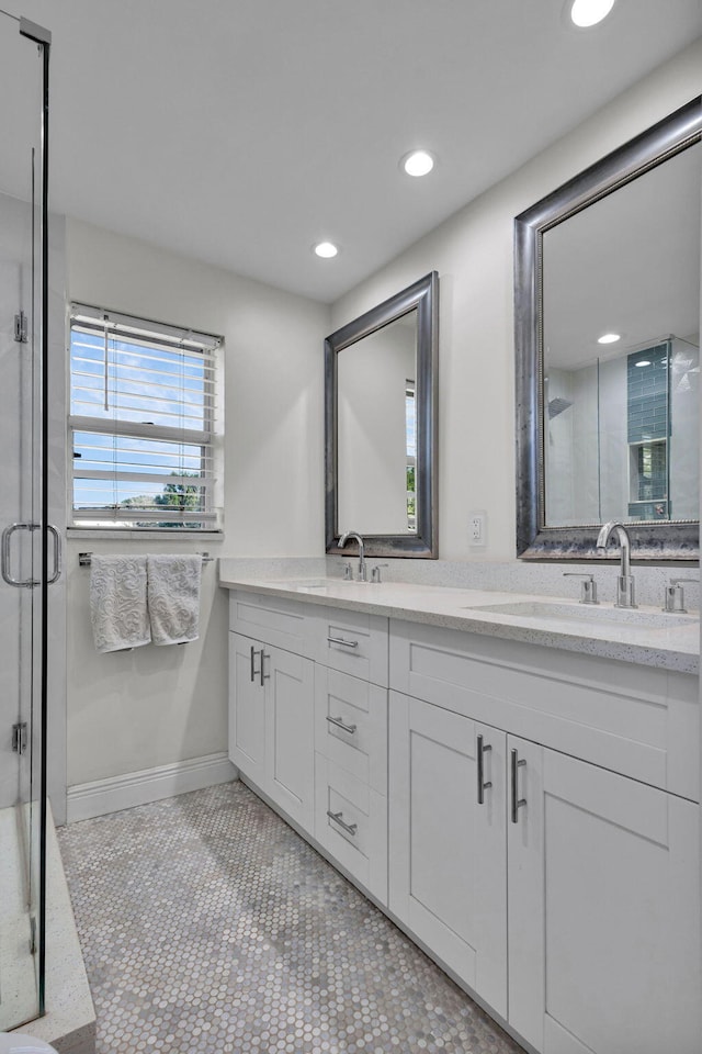 3110 Kingston Ct, West Palm Beach, FL 33409 - full bath featuring double vanity, a shower stall, recessed lighting, and baseboards