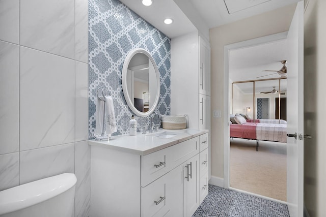 3110 Kingston Ct, West Palm Beach, FL 33409 - bathroom featuring vanity, toilet, ensuite bathroom, recessed lighting, and a ceiling fan