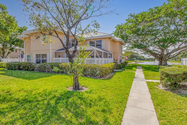 3110 Kingston Ct, West Palm Beach, FL 33409 - view of front of home featuring stucco siding and a front yard