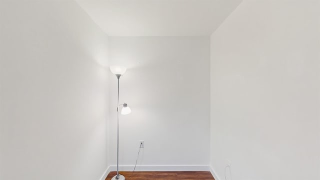 615 6th Ter, Palm Beach Gardens, FL 33418 - empty room featuring baseboards and wood finished floors