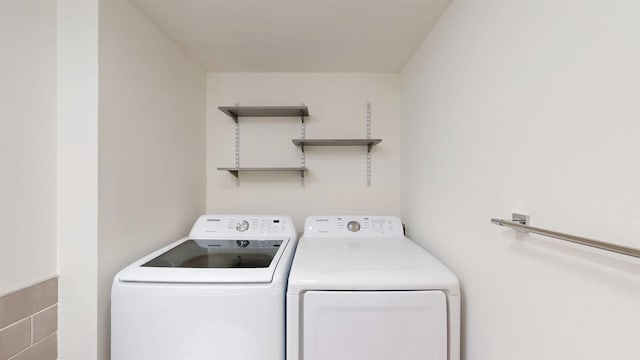 615 6th Ter, Palm Beach Gardens, FL 33418 - laundry room featuring separate washer and dryer