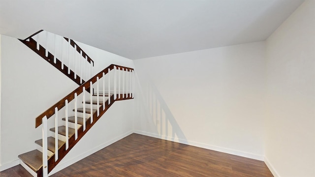 615 6th Ter, Palm Beach Gardens, FL 33418 - stairway with wood finished floors and baseboards