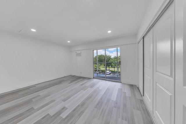 76 Mansfield B 76, Boca Raton, FL 33434 - unfurnished bedroom with access to exterior, light wood-type flooring, recessed lighting, baseboards, and a closet