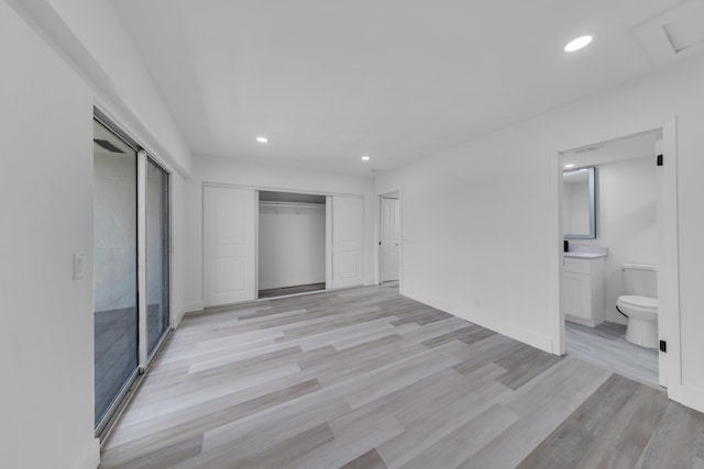 76 Mansfield B 76, Boca Raton, FL 33434 - unfurnished bedroom with recessed lighting, light wood-style flooring, ensuite bathroom, and baseboards