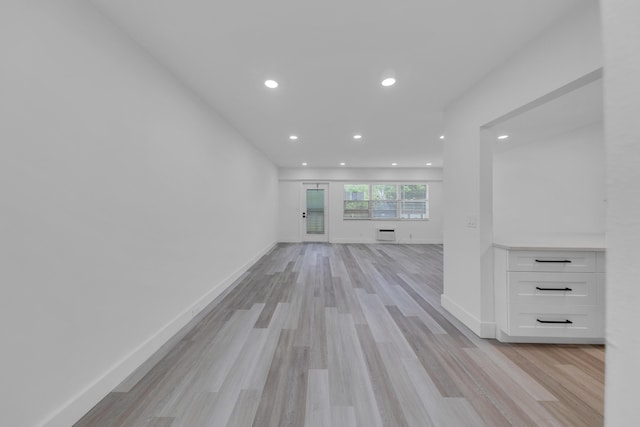 76 Mansfield B 76, Boca Raton, FL 33434 - unfurnished living room with recessed lighting, light wood-style floors, and baseboards