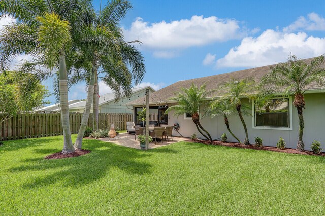 6691 SE Raintree Ave, Stuart, FL 34997 - view of yard with a patio