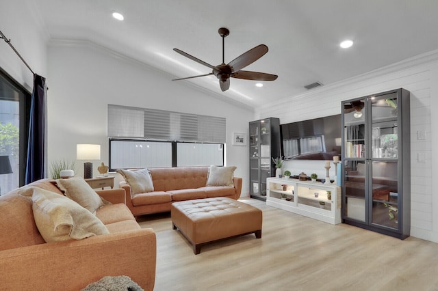 6691 SE Raintree Ave, Stuart, FL 34997 - living area featuring ornamental molding, vaulted ceiling, a ceiling fan, light wood-style flooring, and recessed lighting