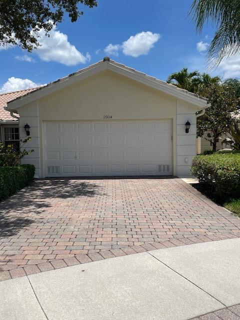 2804 Rio Claro Dr N, Wellington, FL 33414 - garage with decorative driveway