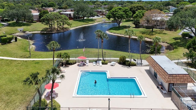 4099 Palm Bay Cir Unit A, West Palm Beach, FL 33406 - community pool featuring a water view, a patio, and a yard
