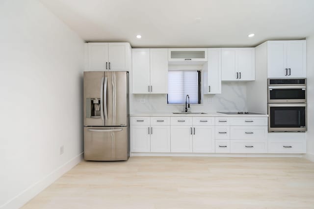 200 SW 48th Ave, Miami, FL 33134 - kitchen with appliances with stainless steel finishes, a sink, white cabinets, and recessed lighting