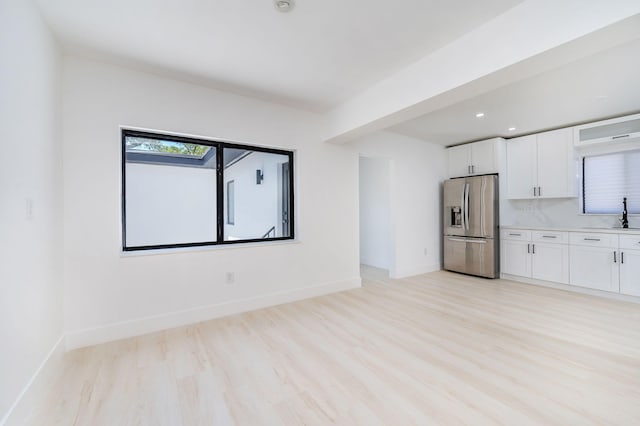 200 SW 48th Ave, Miami, FL 33134 - unfurnished living room with light wood finished floors, baseboards, recessed lighting, and a sink