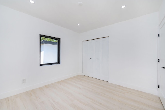 200 SW 48th Ave, Miami, FL 33134 - unfurnished bedroom with wood finished floors, recessed lighting, baseboards, and a closet