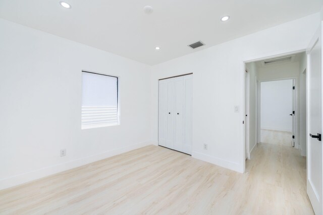200 SW 48th Ave, Miami, FL 33134 - unfurnished bedroom with light wood-style floors, recessed lighting, baseboards, and a closet