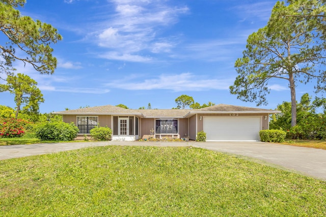 102 SE Crosspoint Dr, Port Saint Lucie, FL 34983 - ranch-style house featuring an attached garage, concrete driveway, and a front lawn