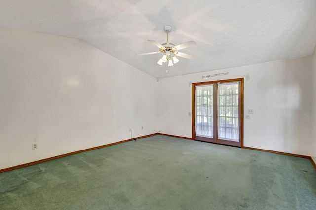 102 SE Crosspoint Dr, Port Saint Lucie, FL 34983 - carpeted spare room featuring baseboards, a ceiling fan, lofted ceiling, and a textured ceiling