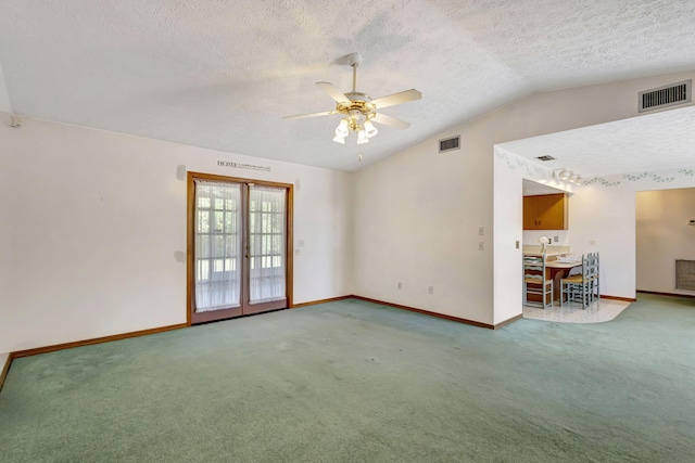 102 SE Crosspoint Dr, Port Saint Lucie, FL 34983 - carpeted spare room featuring lofted ceiling, a textured ceiling, french doors, ceiling fan, and baseboards