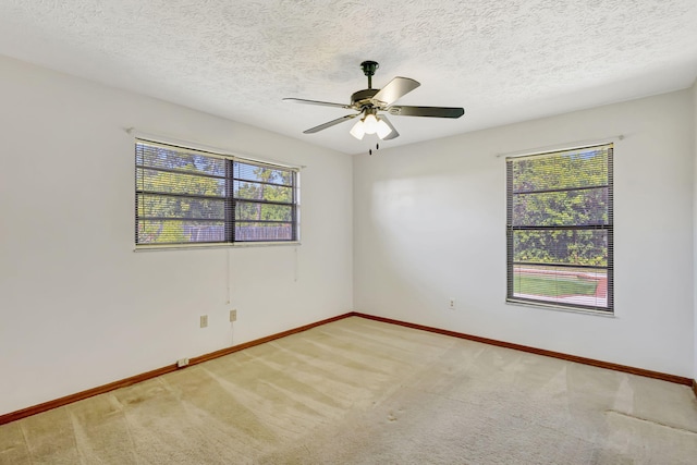 102 SE Crosspoint Dr, Port Saint Lucie, FL 34983 - carpeted empty room with baseboards, a ceiling fan, and a textured ceiling