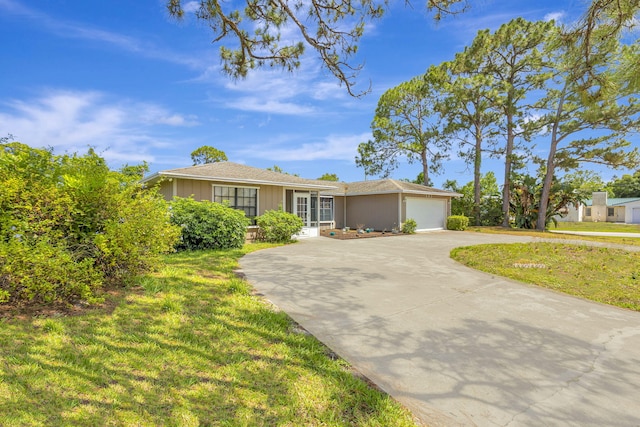 102 SE Crosspoint Dr, Port Saint Lucie, FL 34983 - ranch-style house featuring driveway, an attached garage, a front yard, and board and batten siding