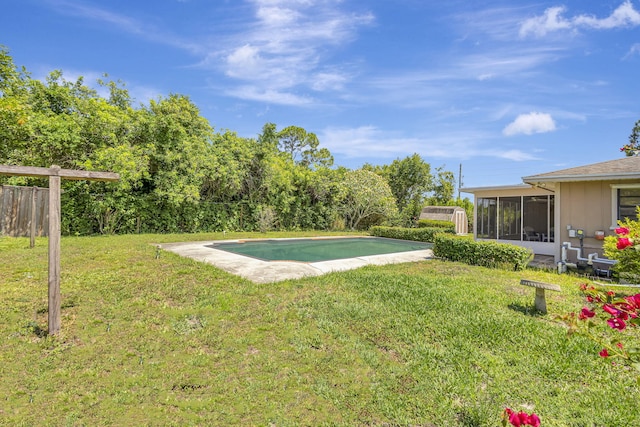 102 SE Crosspoint Dr, Port Saint Lucie, FL 34983 - view of yard featuring a sunroom and an outdoor pool