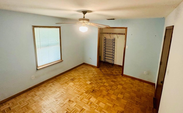 15255 NW 260th St, Okeechobee, FL 34972 - unfurnished bedroom with baseboards, a closet, and ceiling fan
