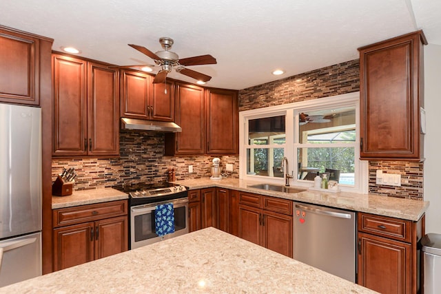 2610 SE Erickson Dr, Port Saint Lucie, FL 34984 - kitchen featuring stainless steel appliances, a sink, ceiling fan, tasteful backsplash, and recessed lighting