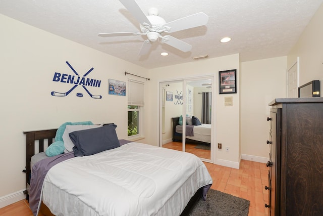 2610 SE Erickson Dr, Port Saint Lucie, FL 34984 - bedroom with light wood-type flooring, a closet, recessed lighting, baseboards, and ceiling fan