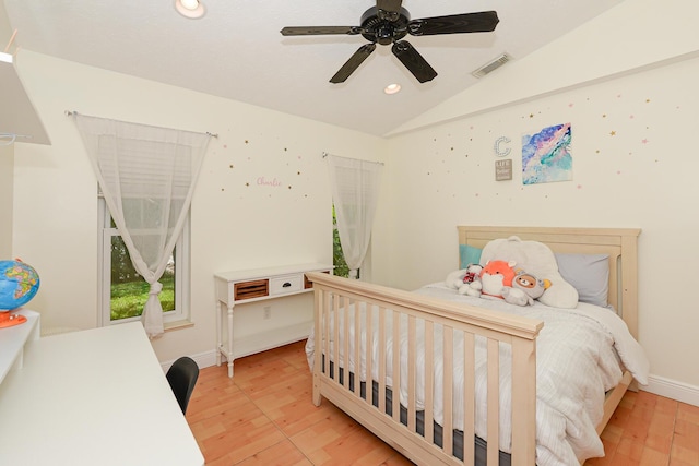 2610 SE Erickson Dr, Port Saint Lucie, FL 34984 - bedroom with light wood-type flooring, recessed lighting, vaulted ceiling, and a ceiling fan