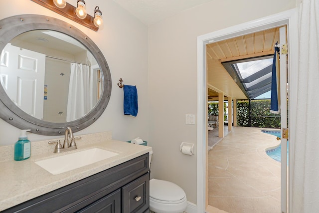 2610 SE Erickson Dr, Port Saint Lucie, FL 34984 - full bathroom featuring vanity, toilet, baseboards, and a shower with shower curtain