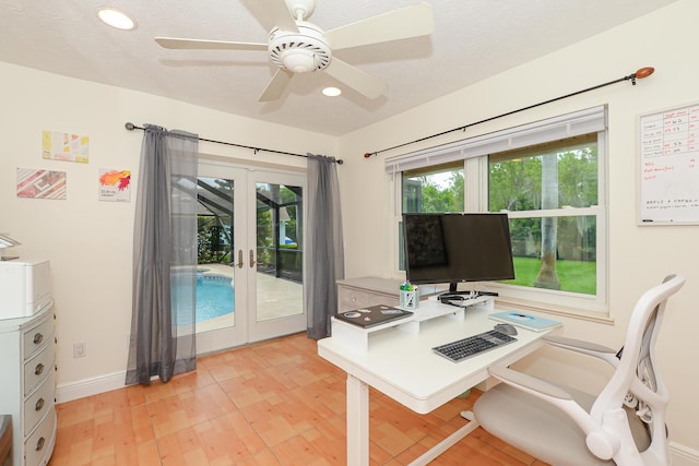2610 SE Erickson Dr, Port Saint Lucie, FL 34984 - home office with french doors, light wood-type flooring, baseboards, recessed lighting, and ceiling fan