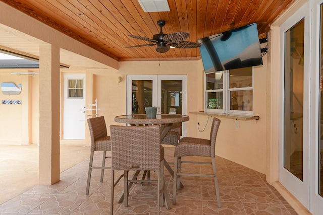 2610 SE Erickson Dr, Port Saint Lucie, FL 34984 - view of patio / terrace featuring french doors, ceiling fan, and outdoor dining space