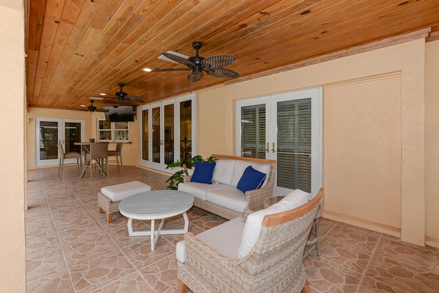 2610 SE Erickson Dr, Port Saint Lucie, FL 34984 - view of patio / terrace featuring french doors, a ceiling fan, and outdoor lounge area