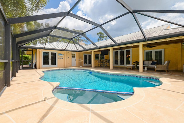 2610 SE Erickson Dr, Port Saint Lucie, FL 34984 - view of pool featuring french doors, an outdoor living space, a pool with connected hot tub, and ceiling fan