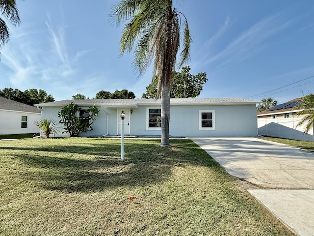 711 NW Riverside Dr, Port Saint Lucie, FL 34983 - single story home featuring stucco siding and concrete driveway