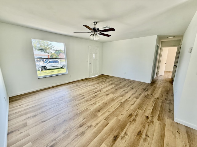 711 NW Riverside Dr, Port Saint Lucie, FL 34983 - spare room featuring light wood finished floors, baseboards, and ceiling fan
