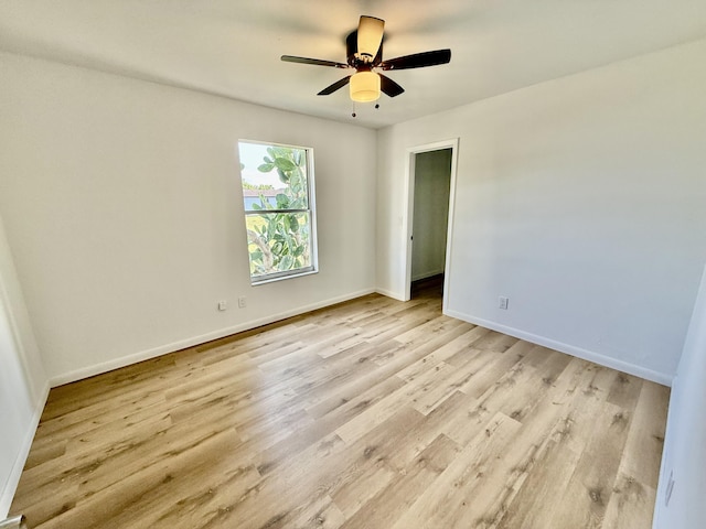 711 NW Riverside Dr, Port Saint Lucie, FL 34983 - spare room with light wood-style floors, baseboards, and ceiling fan
