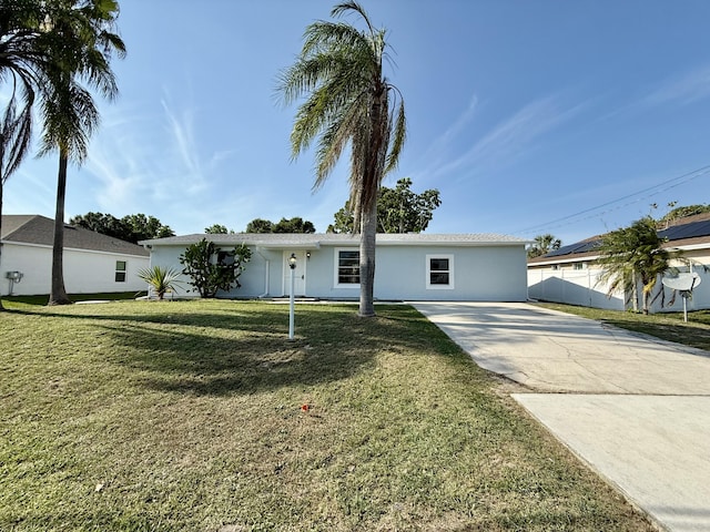 711 NW Riverside Dr, Port Saint Lucie, FL 34983 - single story home featuring stucco siding and concrete driveway