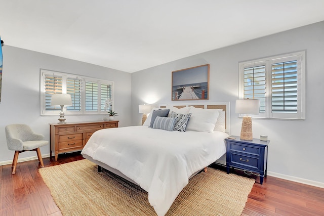 426 NE 7th Ave Unit 1F, Delray Beach, FL 33483 - bedroom featuring wood finished floors and baseboards