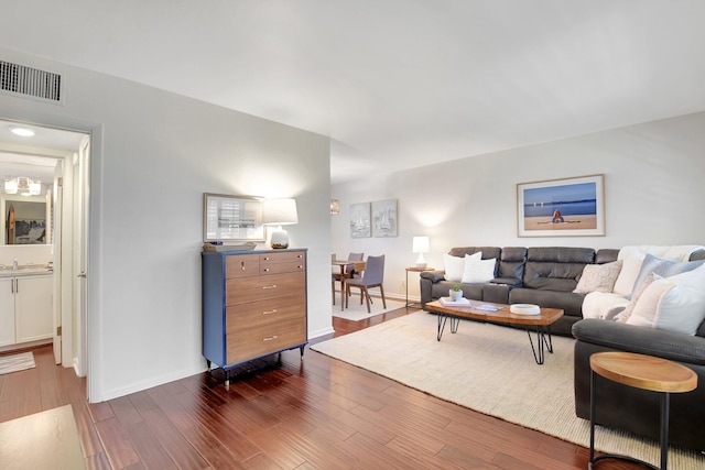 426 NE 7th Ave Unit 1F, Delray Beach, FL 33483 - living area featuring dark wood-type flooring and baseboards