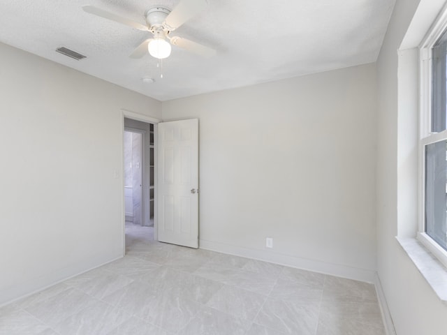 423 N F St, Lake Worth Beach, FL 33460 - unfurnished room with ceiling fan and baseboards