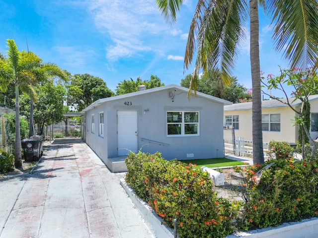 423 N F St, Lake Worth Beach, FL 33460 - view of front of property featuring stucco siding and driveway