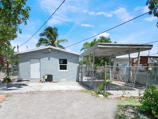 423 N F St, Lake Worth Beach, FL 33460 - view of property exterior with central AC and stucco siding