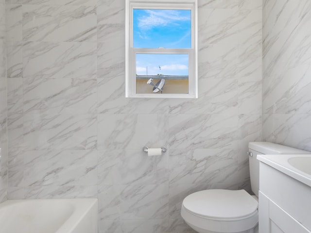 423 N F St, Lake Worth Beach, FL 33460 - bathroom with a bath, toilet, vanity, and tile walls
