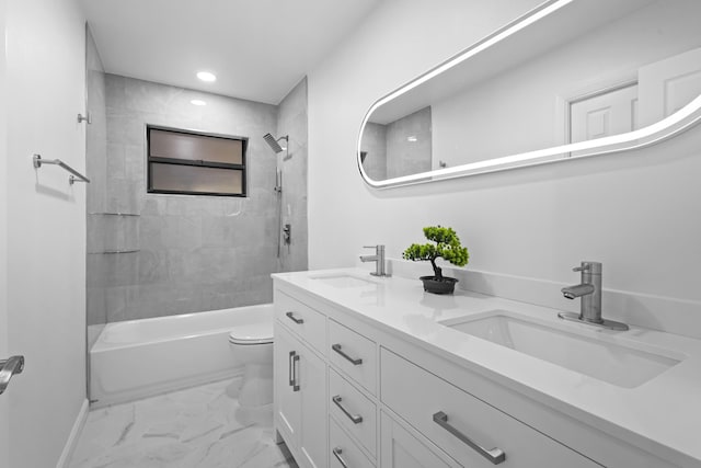 555 Benedictine Ter, Sebastian, FL 32958 - bathroom with toilet, double vanity, marble finish floors, washtub / shower combination, and recessed lighting