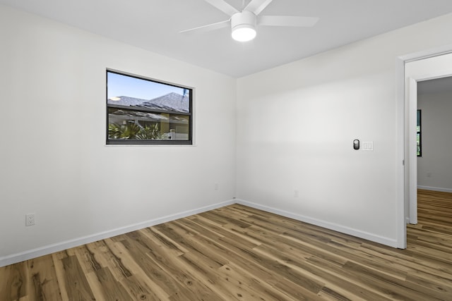 555 Benedictine Ter, Sebastian, FL 32958 - empty room with baseboards, wood finished floors, and ceiling fan