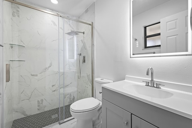 555 Benedictine Ter, Sebastian, FL 32958 - full bathroom featuring toilet, vanity, a marble finish shower, and marble look tiles