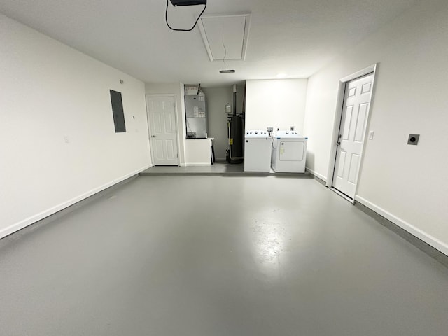 555 Benedictine Ter, Sebastian, FL 32958 - garage featuring water heater, independent washer and dryer, electric panel, baseboards, and heating unit