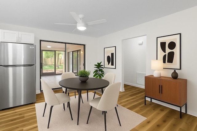 555 Benedictine Ter, Sebastian, FL 32958 - dining space featuring light wood-style flooring, a ceiling fan, and baseboards