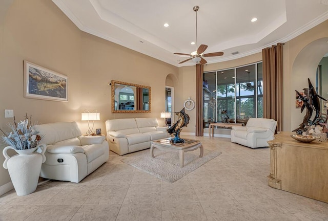 1885 Via Bellezza, Wellington, FL 33411 - living room with arched walkways, a tray ceiling, crown molding, ceiling fan, and recessed lighting
