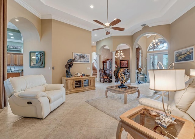 1885 Via Bellezza, Wellington, FL 33411 - living room with arched walkways, a chandelier, ornamental molding, recessed lighting, and decorative columns