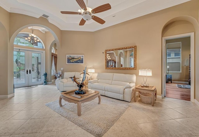 1885 Via Bellezza, Wellington, FL 33411 - tiled living area featuring arched walkways, a chandelier, ornamental molding, french doors, and a ceiling fan